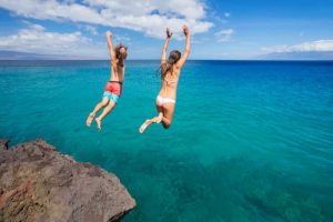 2 girls jumping off a clip